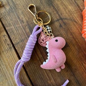 Dinosaur kitty pink bag charm keychain